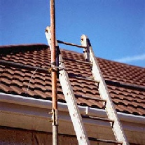 Ladders ready on tile roof